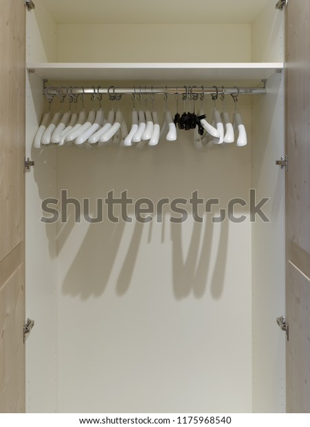 Empty Open Wardrobe Coat Hangers Stock Photo Edit Now 1175968540