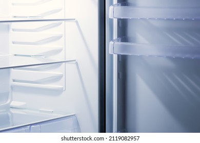 Empty Open White Refrigerator. Inside View Of An Empty Modern Refrigerator