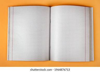 Empty Opened Notepad on the Yellow Paper Background closeup