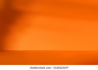 Empty orange room and deep artistic shadow  Minimalistic space concept