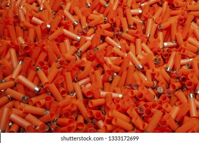 Empty Orange Shotgun Cartridges