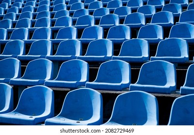empty outdoor arena. concept of fans. chairs for audience. cultural environment concept. color and symmetry. empty seats. modern stadium. blue tribunes. seats of tribune on sport stadium - Shutterstock ID 2082729469