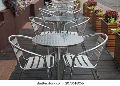 Empty Outdoor Cafe, Metal Tables And Chairs.