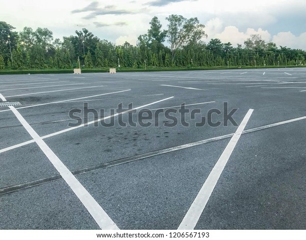 empty outdoor car\
parking lot at evening