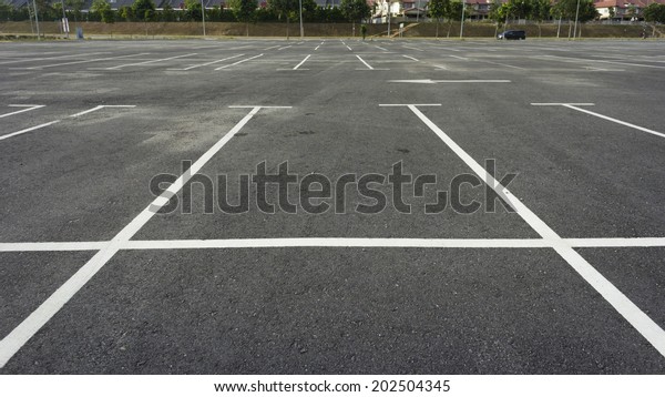 Empty outdoor parking\
lot