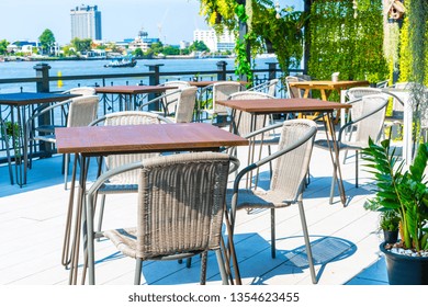 Empty Outdoor Patio Table And Chair In Restaurant And Coffee Shop