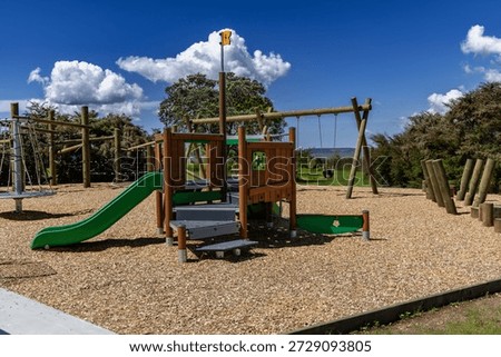 Empty Outdoor Playground Structure Under Bright Sky
