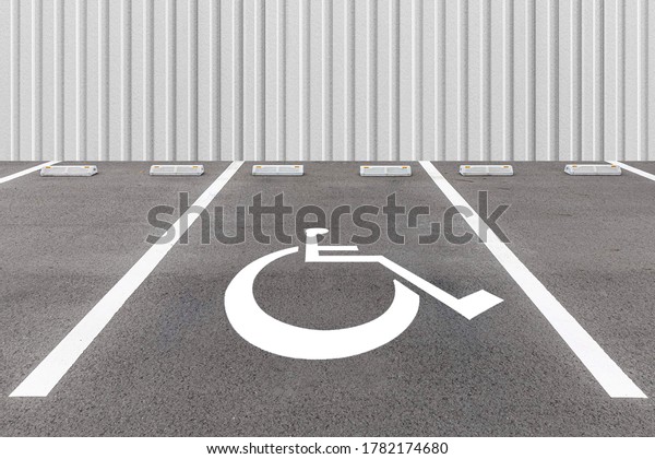 Empty outdoor\
public parking for the\
disabled