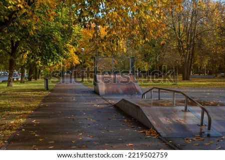 An empty outdoor skate park in Police park (Estonian - Politsepark) on a sunny autumn day. Tallinn, Estonia.