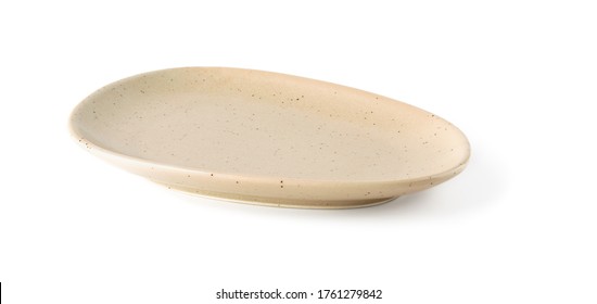 Empty Oval Beige Ceramic Plate Isolated On A White Background. Clay, Ceramics Or Porcelain Crockery And Tableware. Front View.