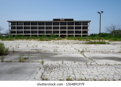 Empty overgrown parking lot   abandoned  former hospital building  Tinley Park Illinois