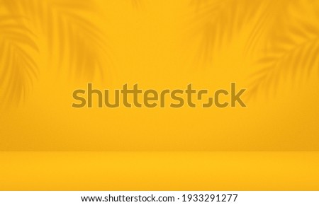 Empty palm shadow yellow color texture pattern cement wall background. Used for presentation  business nature organic cosmetic products for sale shop online. Summer tropical beach with minimal concept