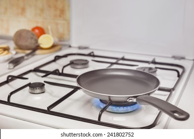 Empty Pan On The Stove Burning Flame