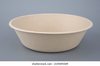 Empty Paper Bowl Isolated On Gray Background. Container For Food