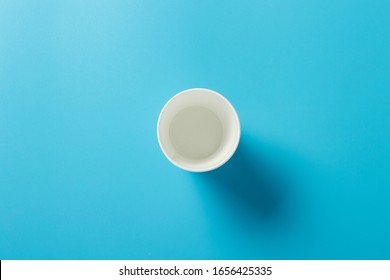 Empty Paper Cup For Drinks On A Blue Background. Banner. Flat Lay, Top View