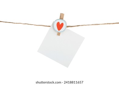Empty paper note hanging on a rope isolated on a white background