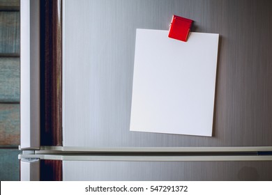 Empty paper sheet on refrigerator door with magnetic clip paper note for add text message. - Powered by Shutterstock