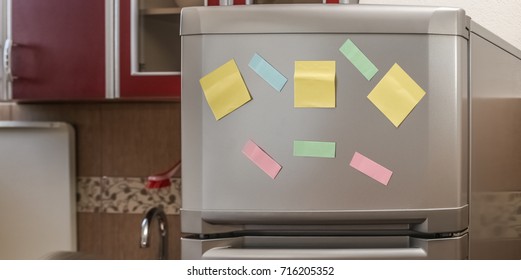 Empty paper sheet on refrigerator door with magnetic clip paper note for add text message.