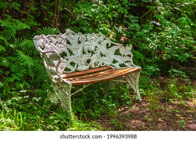 Empty Park Bench By A Path In A Park