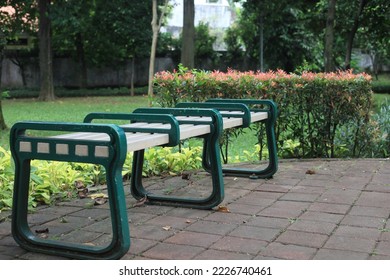 Empty Park Bench In City Park