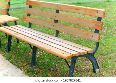 Empty Park Bench In The Garden