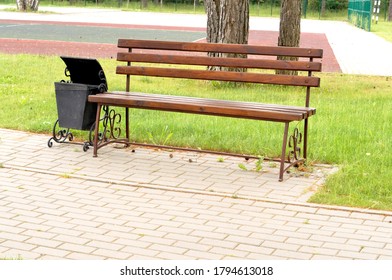 Empty Park Bench In Spring Morning