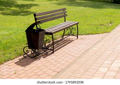 Empty Park Bench In Spring Morning