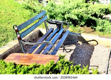 Empty Park Bench In Spring Morning