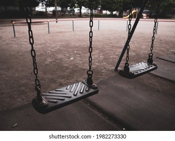 An empty park and old swings.