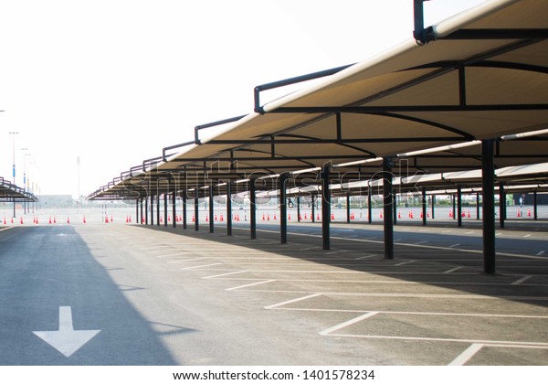 Empty parking lot with\
canopy shade