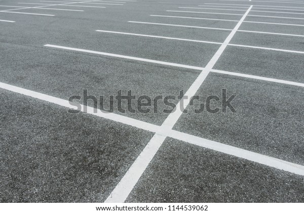 Empty parking lot at city\
center, Vacant Parking Lot, Parking lane painting on floor, copy\
space