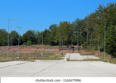 Empty Parking Lot In Forest Park Woods Landscape