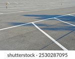 An empty parking lot with freshly painted markings