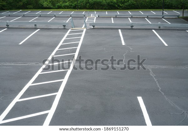 empty\
parking lots outdoor with pedestrian walk\
lane