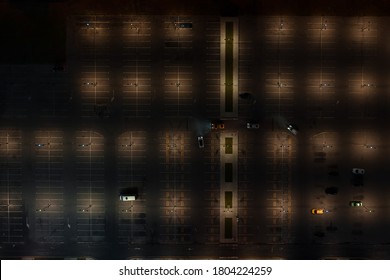 Сars In An Empty Parking Lot At Night