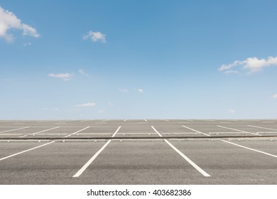 Empty Parking Lot On Sunset Background