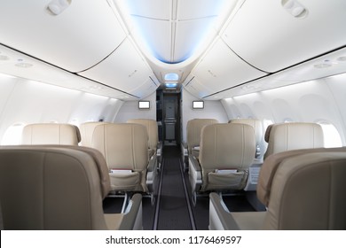 Empty passenger airplane seats in cabin. Interior in modern airplane.