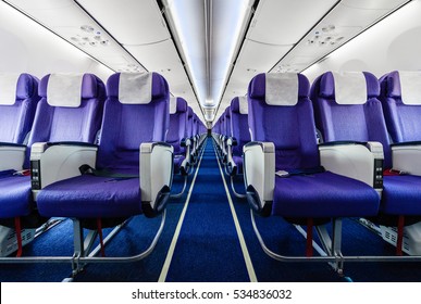 Empty passenger airplane seats in the cabin
