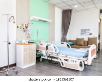 Empty Patient Bed In A Hospital Ward With Modern Equipment, Blurred Background.