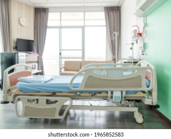 Empty Patient Bed In A Hospital Ward With Modern Equipment, Blurred Background.