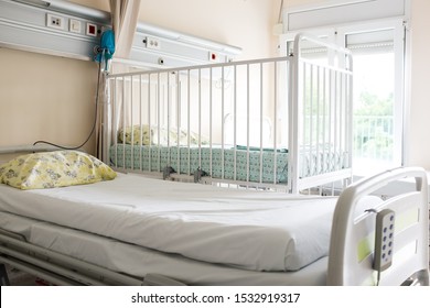 Empty Patient Beds In A Children's Hospital Room Or Maternity Ward, Coronavirus Or Corona Virus COVID-19 Epidemic Pandemic Quarantine Concept