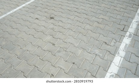 Empty paved parking lot with marked lines.