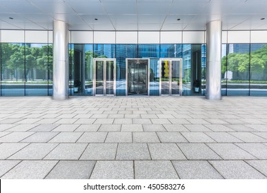 Empty Pavement Front Of Office Entrance