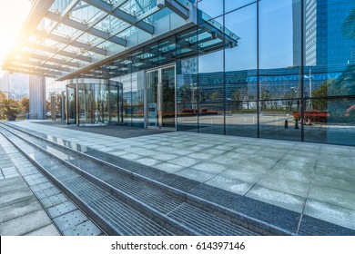 Empty Pavement Front Of Office Entrance