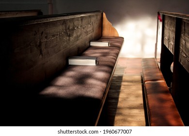 Empty Pews With Soft Sunlight In A Catholic Church.