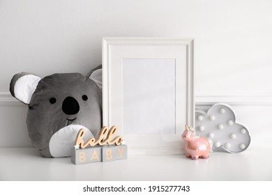 Empty Photo Frame, Cute Toy And Decor Near Wall, Space For Text. Baby Room Interior Element