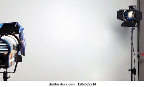 Empty photo shooting studio between two standing spotlights realistic for interview or photography session. copy space in the middle background. - Shutterstock ID 1286529214