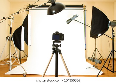 Empty photo studio with lighting equipment - Shutterstock ID 104350886