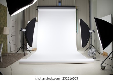 Empty Photo Studio With Lighting Equipment 