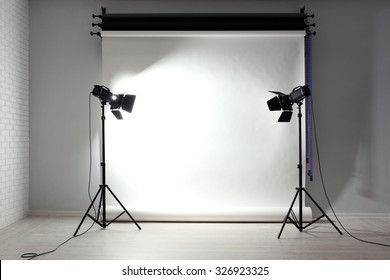 Empty Photo Studio With Lighting Equipment